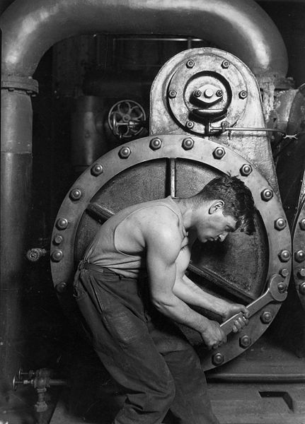 Lewis Hine, Power house mechanic working on steam pump, 1920
