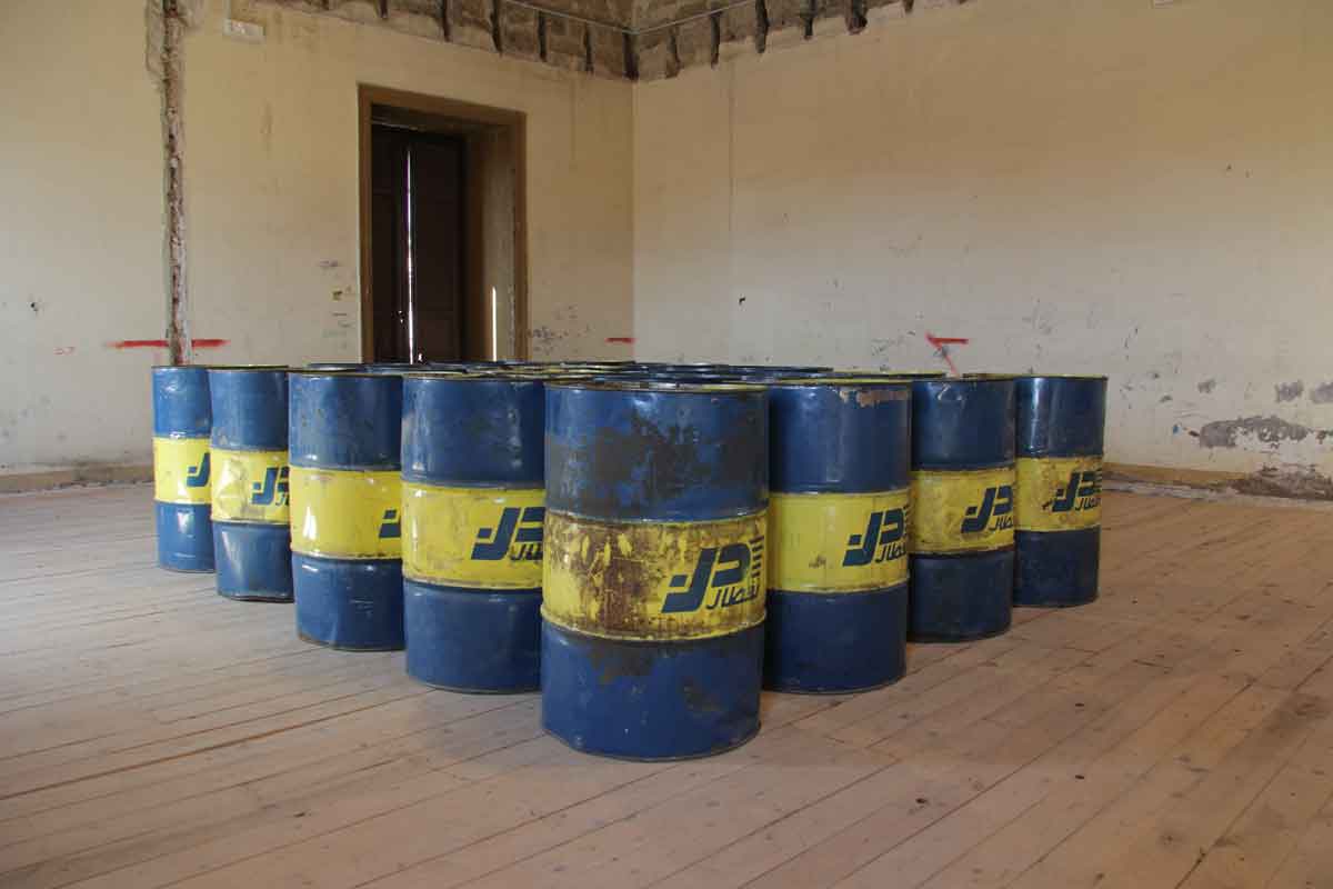 5.LYDIA OURAHMANE The Third Choir, 2014 Installation 20 Naftal oil barrels imported from Algeria, CZ-5HE Radio Transmitter and 20 E2121B Samsung phones 104.5 x 45 x 14.6 mm Dimensions variable Photo: Wolfgang Träger Photo Courtesy the artist and Jonathan Ellis King, Ireland